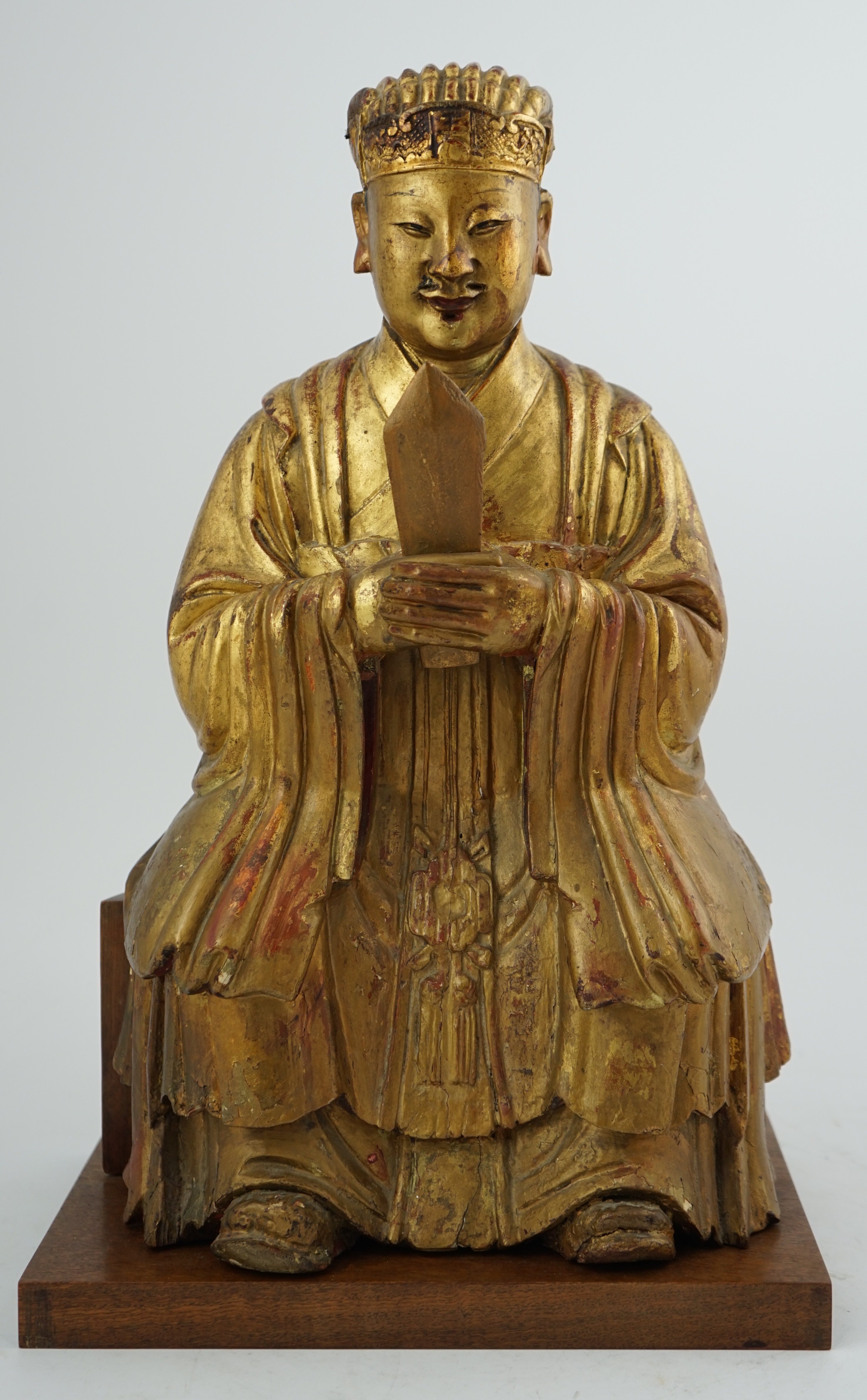 A Chinese gilt lacquered wood seated figure of Wenchang Wang, late Ming, 17th century